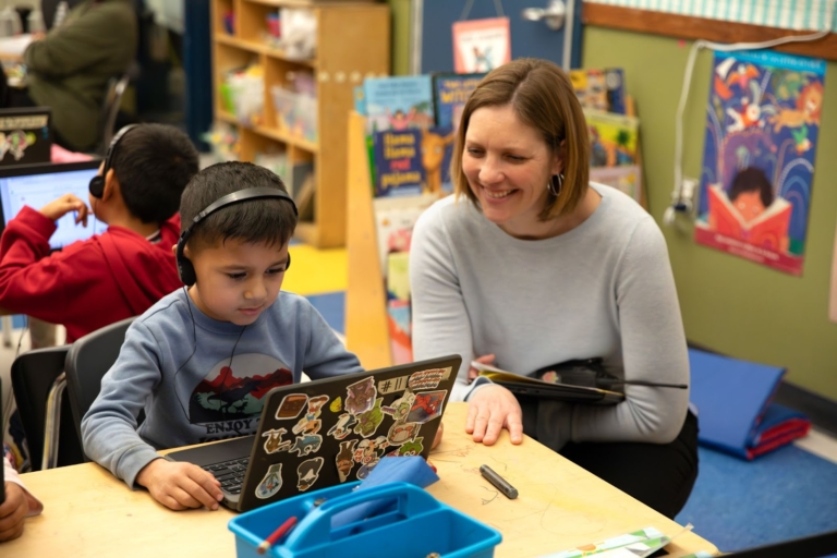 Principal Taylor Parham With A Young Reader