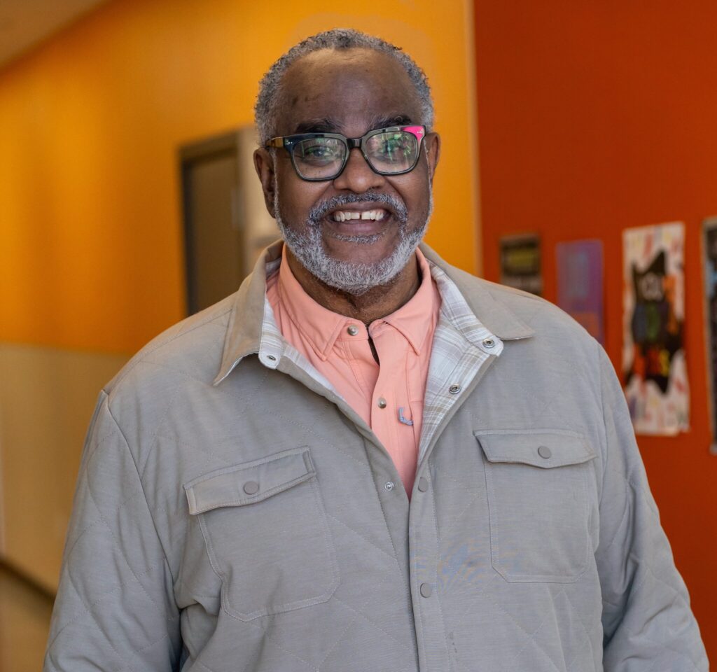 Terence Johnson smiles as he poses for a photo.